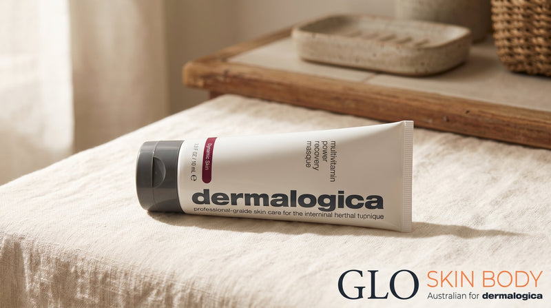Dermalogica Multivitamin Power Recovery Masque tube on a soft cream surface in warm morning light